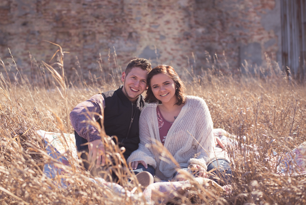 Engagement Photography couple in grass field Alma MI