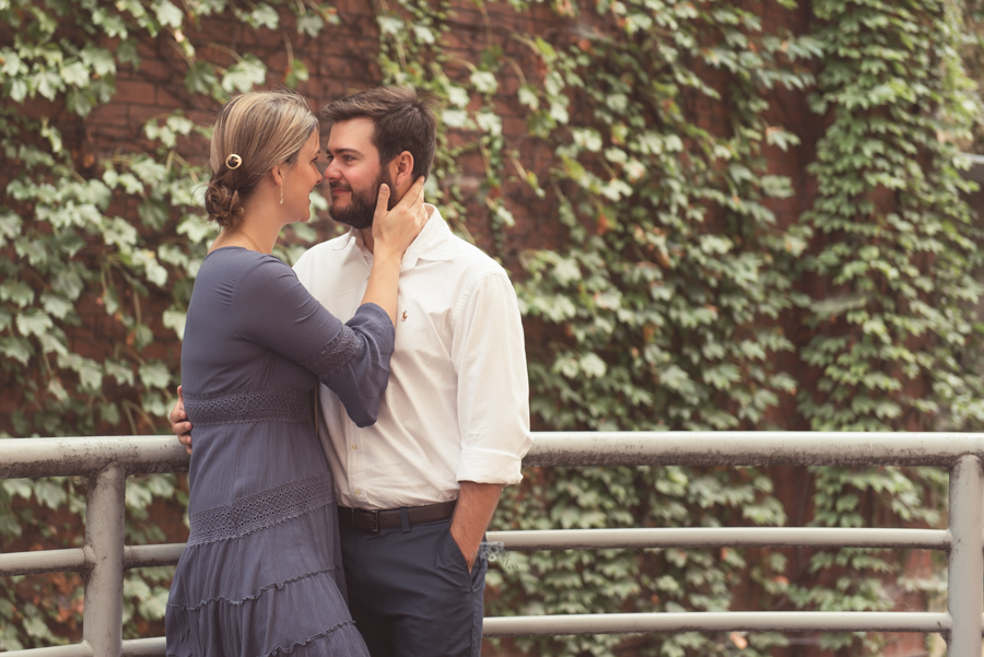 Couple engagement portraits in Grand Rapids by ivy wall