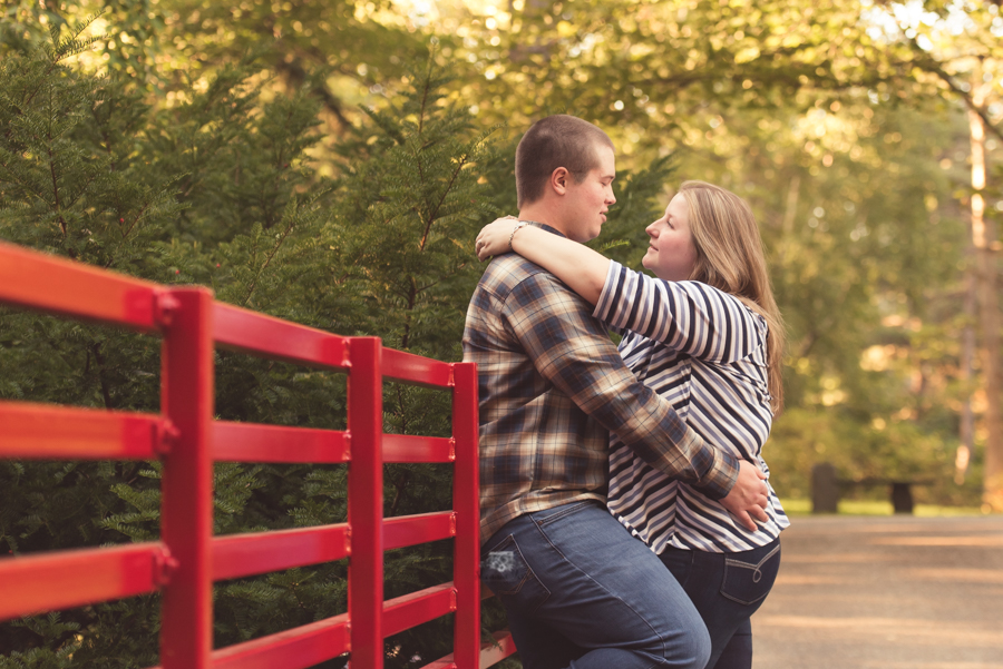 Engagement Photography at Dow Gardens on red bridge
