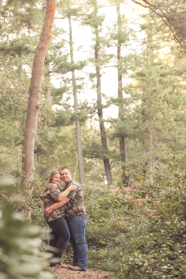 Engagement Photography at Dow Gardens in wooded walk way