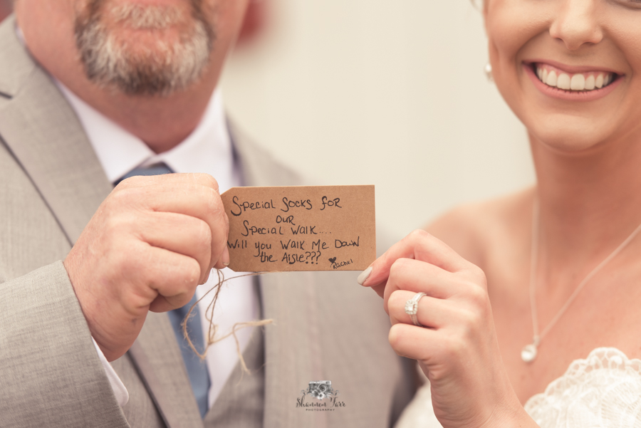 bride and father holding letter