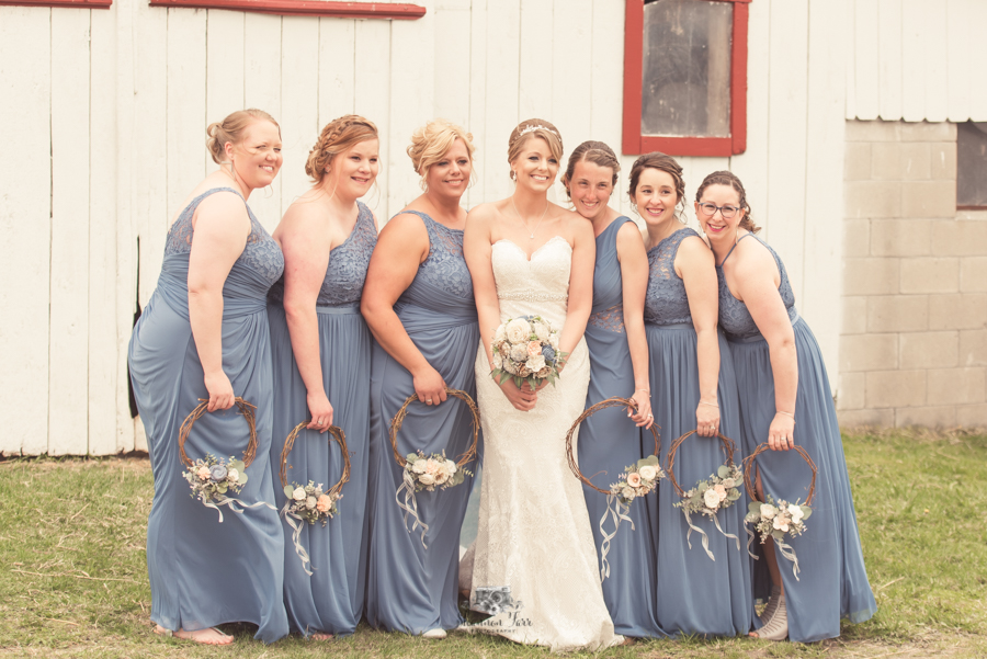 Bridemaids with blue dress and wreaths