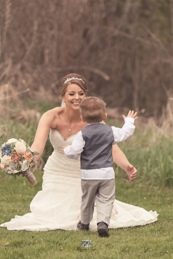 Son running to give bride hug