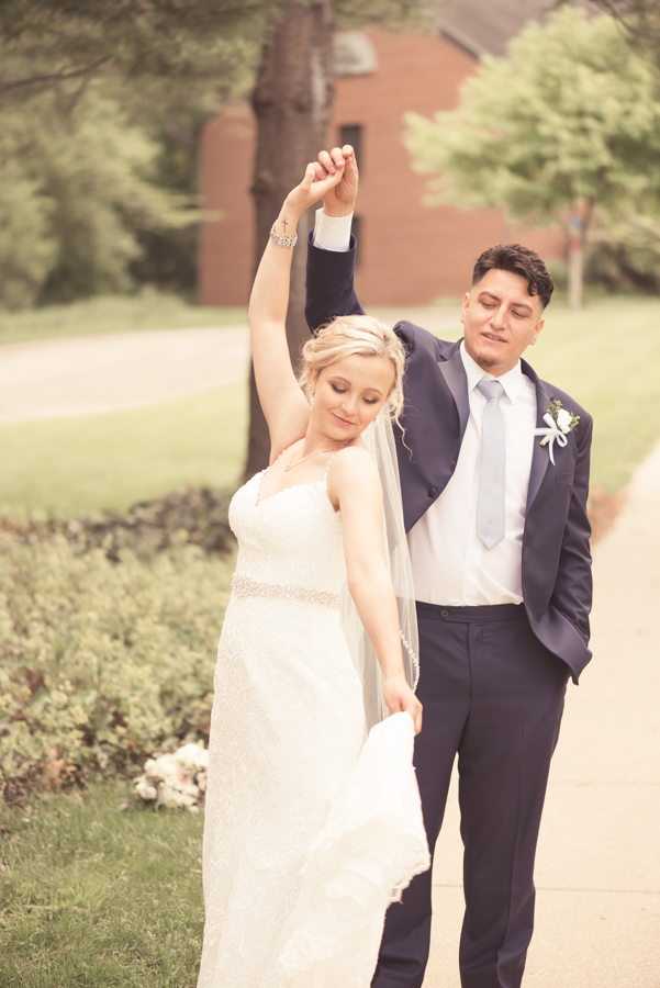 couple twirling at Kuyper College