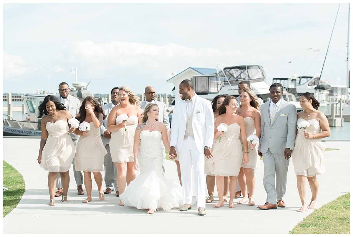 bridal party walking on pier in tawas