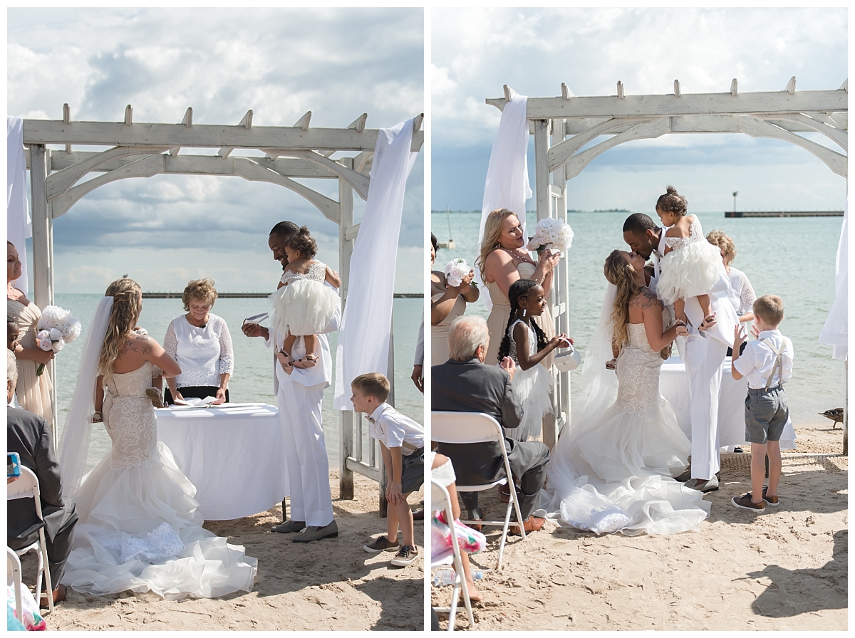bride and groom kissing at tawas beach bay resort