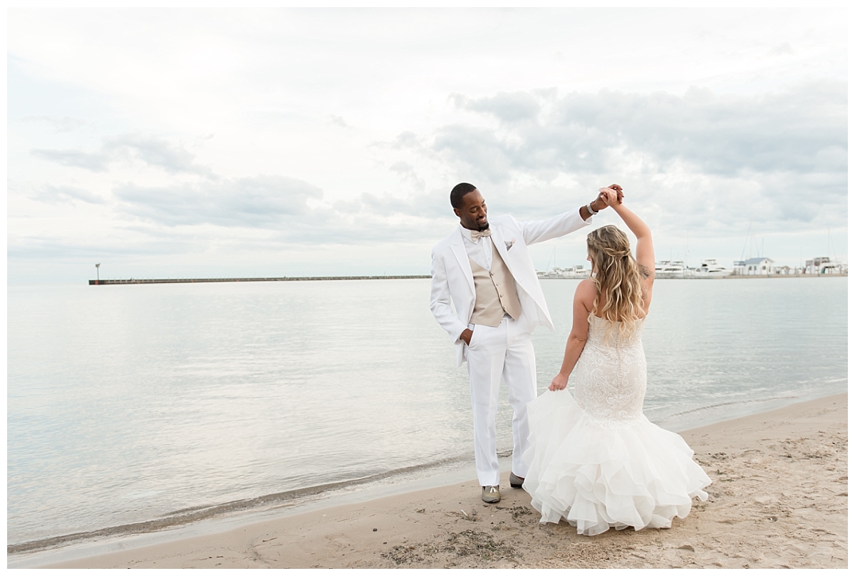 bride twirling on beach in tawas