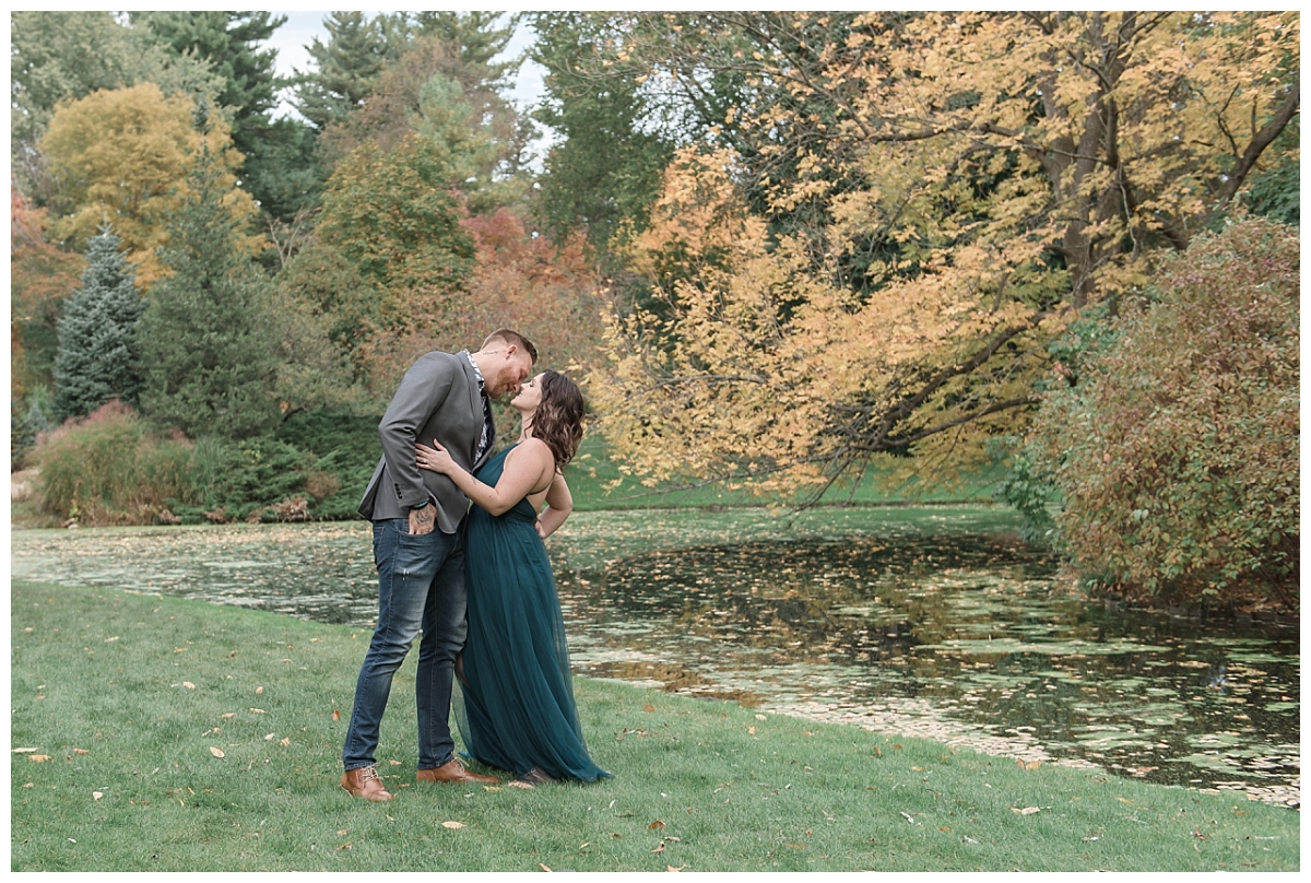 couple kissing by creek at dow gardens