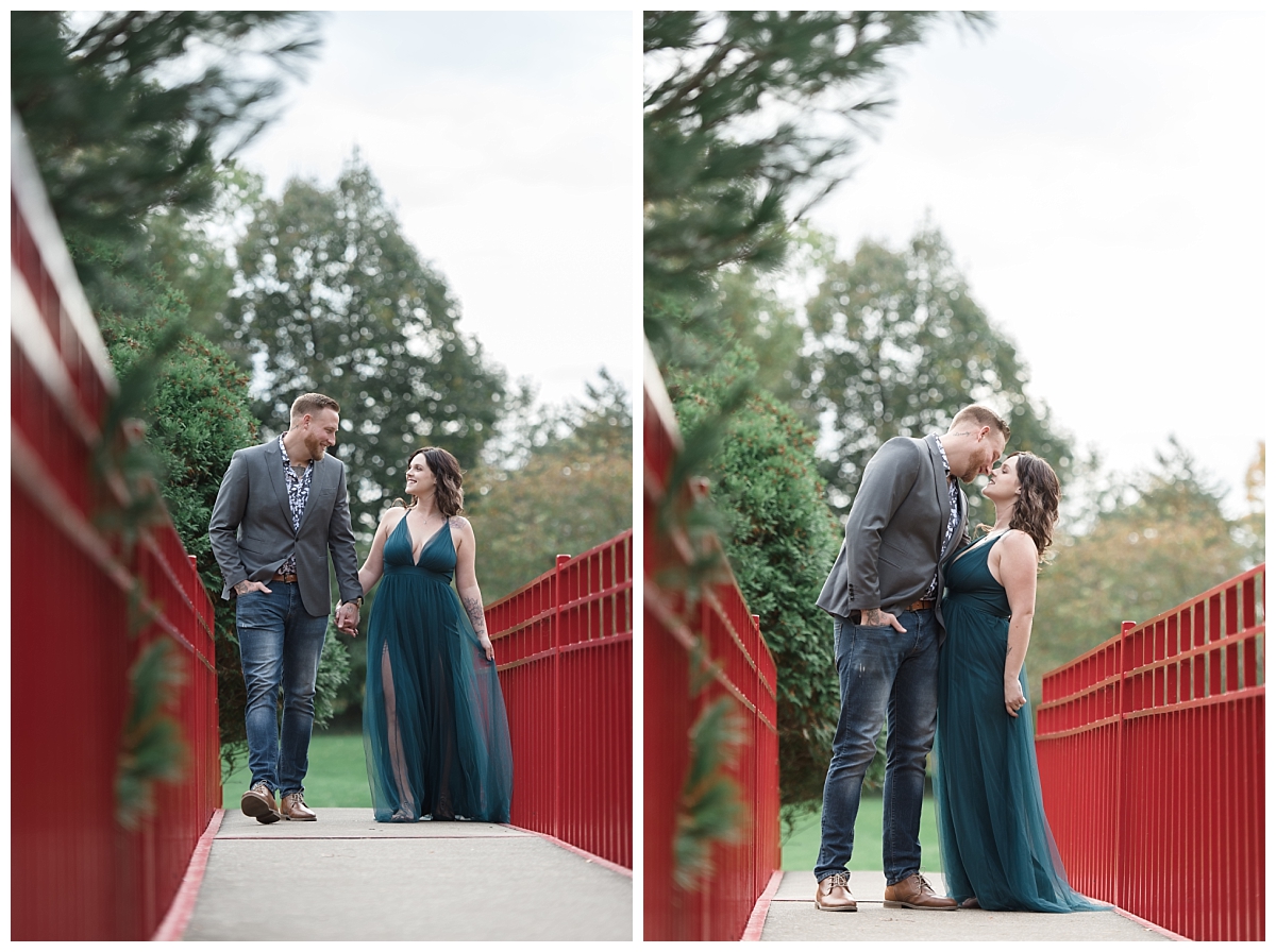 couple walking on red bridge at dow gardens