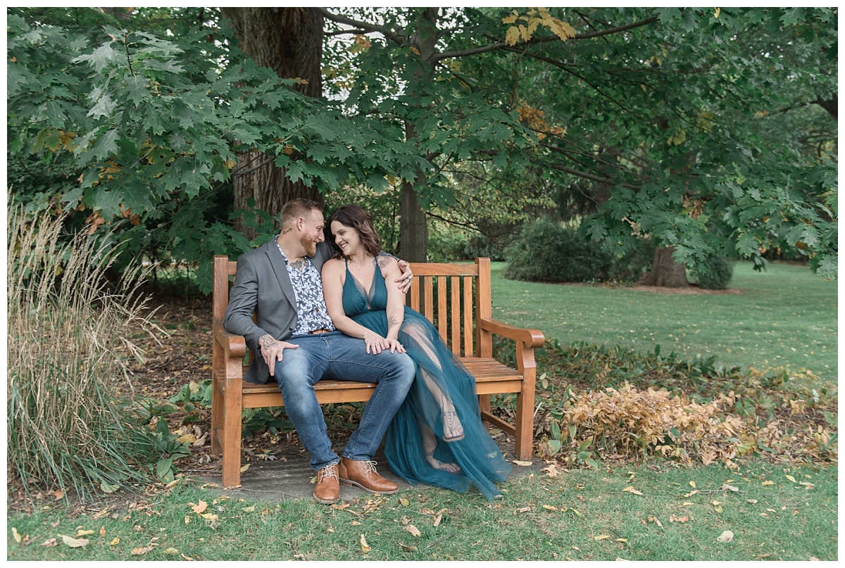couple sitting on bench at dow gardens